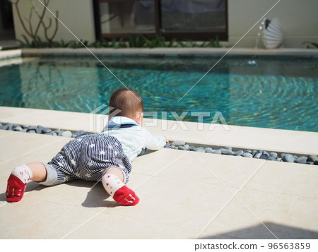 kids relaxing by the pool kids relaxing by the pool 96563859