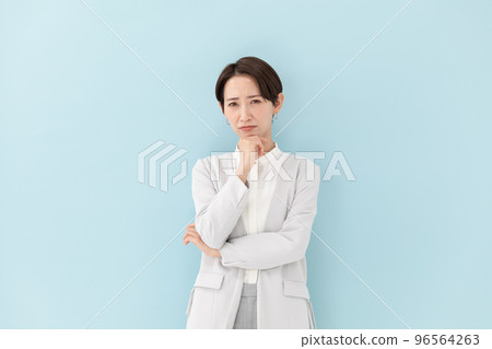 Business Worried Woman Blue Back Business Worried Woman Blue Back 96564263