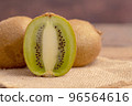 A half kiwi slice placed on the brown sack 96564616