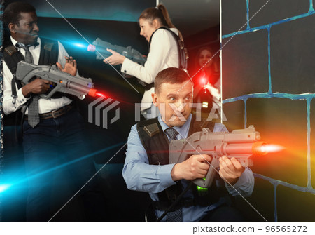 men and women co-workers having corporate entertainment 96565272