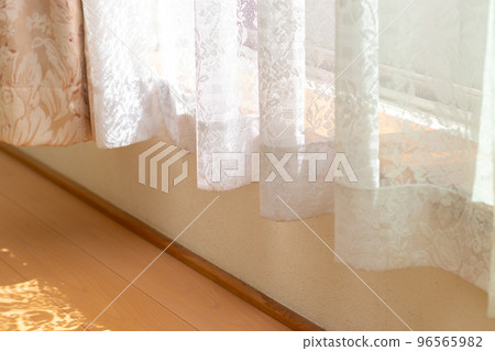 White lace curtains that block sunlight from windows 96565982