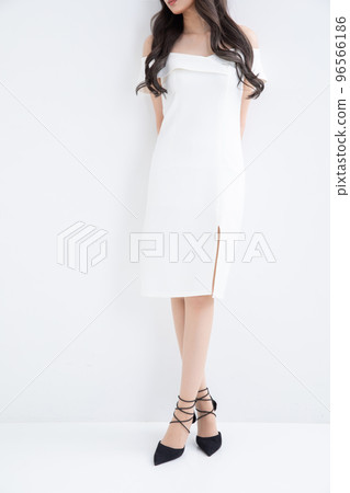 A woman in a white dress sexy A woman in a white dress sexy 96566186