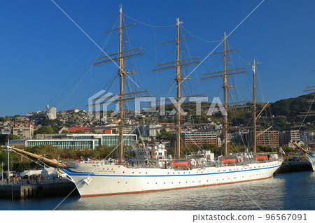 A view of a sailing ship anchored at Nagasaki Port with a beautiful contrast with the blue sky A view of a sailing ship anchored at Nagasaki Port with a beautiful contrast with the blue sky 96567091