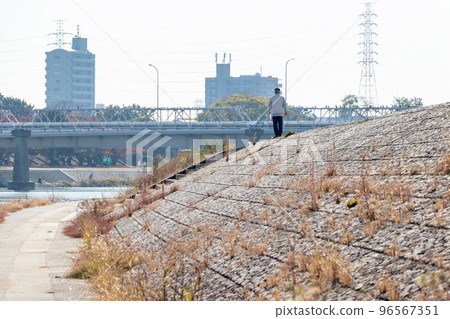 Embankment of river bank in winter with sunshine 96567351