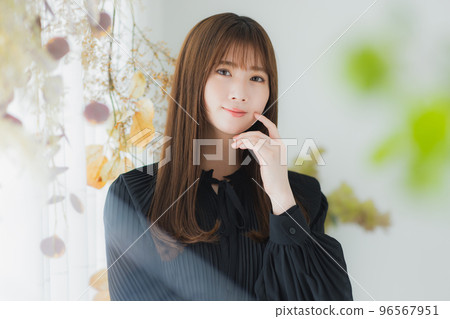 A woman by the window 96567951