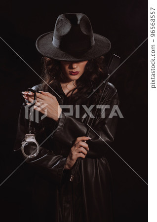 Sexy female dominant mistress with a whip flogger and handcuffs for BDSM sex with submission and domination Sexy female dominant mistress with a whip flogger and handcuffs for BDSM sex with submission and domination 96568557