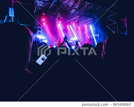 Crowd raising their hands and enjoying great festival party or concert. 96569868