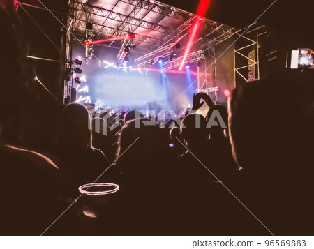 Crowd raising their hands and enjoying great festival party or concert. 96569883