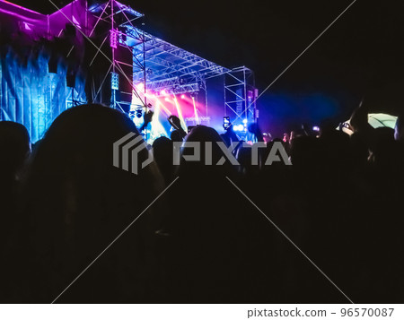 Crowd raising their hands and enjoying great festival party or concert. 96570087