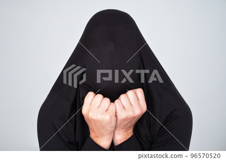 Male silhouette breaking through the fabric. Struggle and inner demon concept. 96570520