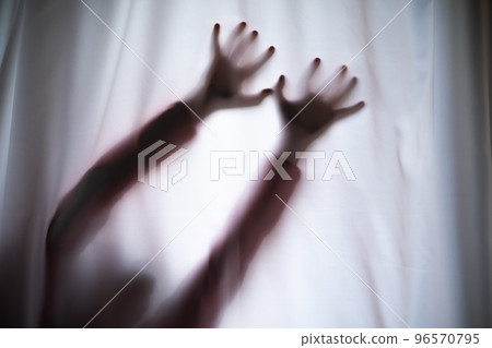 Depressed Man with mantal problems hiding above the curtain.  96570795