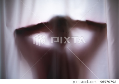 Depressed Man with mantal problems hiding above the curtain.  96570798