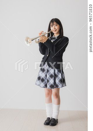 A high school girl with a trumpet 96571810