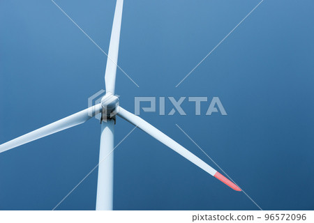 Wind turbines against a blue sky generating electricity - concept of sustainable development and renewable energy Wind turbines against a blue sky generating electricity - concept of sustainable development and renewable energy 96572096