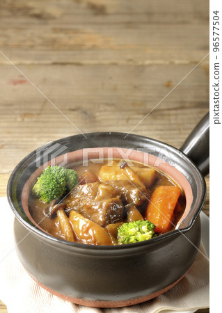Hot beef stew with lots of ingredients such as broccoli, carrots, and shimeji mushrooms in a pot 96577504