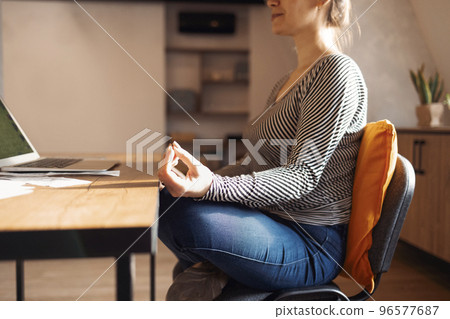 Stress relief during freelance work. Brunette woman freelancer Stress relief during freelance work. Brunette woman freelancer 96577687