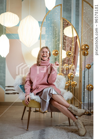 Cheerful woman posing in studio 96578181