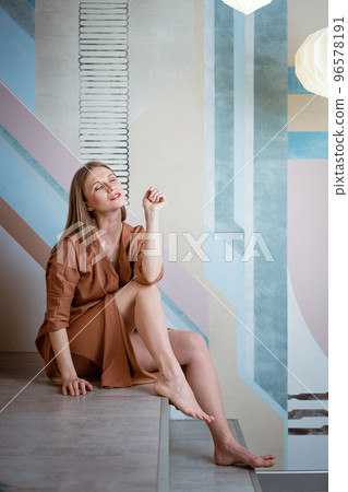 cute woman posing in studio in dress cute woman posing in studio in dress 96578191