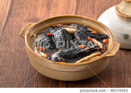 Delicious silky chicken soup with Chinese herbal medicine Delicious silky chicken soup with Chinese herbal medicine 96578463