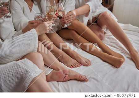 Clinking glasses with alcohol and toasting, party. 96578471