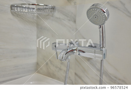 detail of a corner shower cabin with wall mount shower attachment. 96578524
