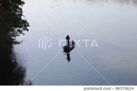 Lake fishing boat and angler Lake fishing boat and angler 96578624