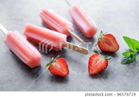 Strawberry ice cream popsicles 96578719