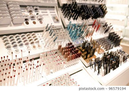 Shelves with makeup products in a cosmetics store indoor. Shelves with makeup products in a cosmetics store indoor. 96579194