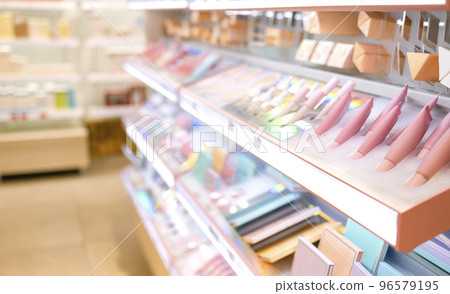 Shelves with makeup products in a cosmetics store indoor. 96579195
