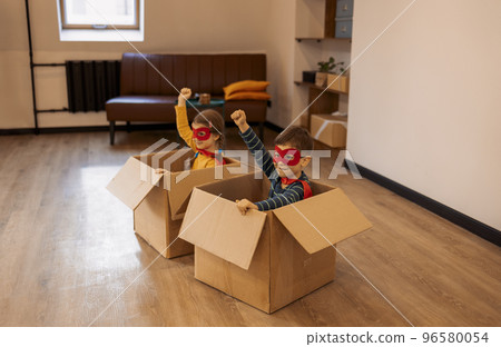 Superhero children. Super hero kids, brother and sister, playing at home 96580054