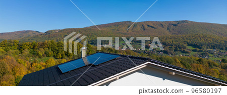 High angle view of solar photovoltaic panels on roof, alternative energy, saving resources and sustainable lifestyle concept. High angle view of solar photovoltaic panels on roof, alternative energy, saving resources and sustainable lifestyle concept. 96580197