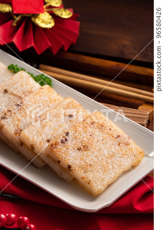 Delicious Chinese radish cake for lunar new year celebration cuisine. Delicious Chinese radish cake for lunar new year celebration cuisine. 96580426