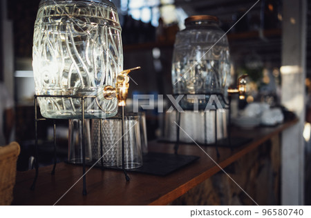 Two glass dispensers with metal tap and a lid 96580740