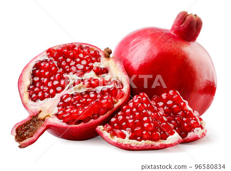 Pomegranate, half and pieces close-up on a white background. Isolated 96580834