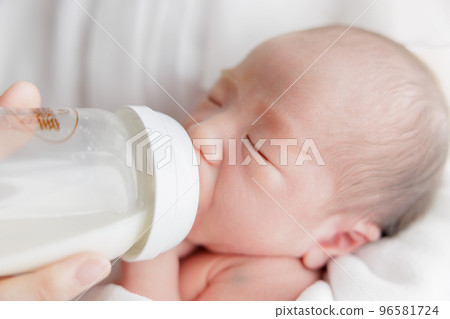 Breast feeding milk feeding bottle baby newborn Breast feeding milk feeding bottle baby newborn 96581724