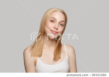 Pretty blonde woman with long blonde hair and fresh skin on white background Pretty blonde woman with long blonde hair and fresh skin on white background 96581980