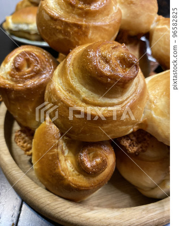 Fresh homemade puff pastry buns. Vertical photo format. Fresh homemade puff pastry buns. Vertical photo format. 96582825