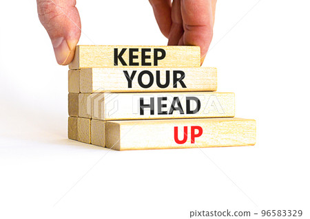 Keep your head up symbol. Concept words Keep your head up on wooden cubes. Beautiful white table white background. Businessman hand. Business motivational keep your head up concept. Copy space. 96583329