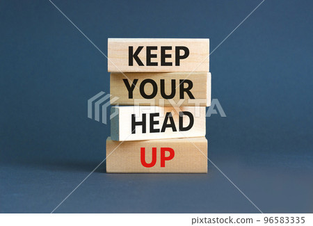 Keep your head up symbol. Concept words Keep your head up on wooden cubes. Beautiful grey table grey background. Business motivational keep your head up concept. Copy space. 96583335