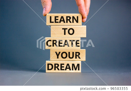 Create your dream symbol. Concept words Learn to create your dream on wooden blocks. Businessman hand. Beautiful grey table grey background. Business learn to create your dream concept. Copy space. Create your dream symbol. Concept words Learn to create your dream on wooden blocks. Businessman hand. Beautiful grey table grey background. Business learn to create your dream concept. Copy space. 96583355