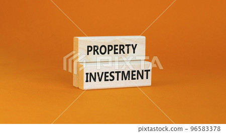 Property investment symbol. Concept words Property investment on wooden blocks on a beautiful orange table orange background. Business Property investment concept. Copy space. Property investment symbol. Concept words Property investment on wooden blocks on a beautiful orange table orange background. Business Property investment concept. Copy space. 96583378