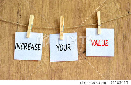 Increase your value symbol. Concept words Increase your value on white paper on a beautiful wooden table wooden background. Business increase your value concept. Copy space. Increase your value symbol. Concept words Increase your value on white paper on a beautiful wooden table wooden background. Business increase your value concept. Copy space. 96583415