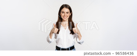 Happy smiling girl showing thumbs up, student with satisfied feedback, recommending smth, standing over white background Happy smiling girl showing thumbs up, student with satisfied feedback, recommending smth, standing over white background 96586436