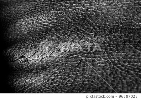 Focus stack macro of cracked faux leather on furniture with visible damage. Focus stack macro of cracked faux leather on furniture with visible damage. 96587025