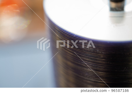 Selective focus on a sleeve of compact discs CD's used for storing electronic media. 96587186