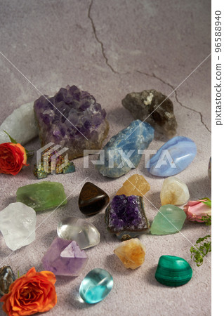 various gem stones on a gray background 96588940