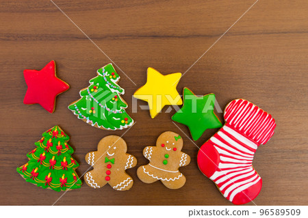Festive tasty Christmas cookies on wooden table. Top view 96589509