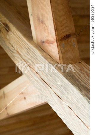 Wooden post with struts. Wooden post with struts. 96589554