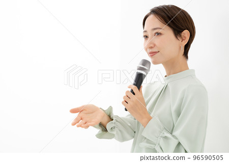 Woman holding a microphone White background Woman holding a microphone White background 96590505