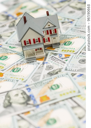 Small Model House on Layer of One Hundred Dollar Bills. Small Model House on Layer of One Hundred Dollar Bills. 96590668